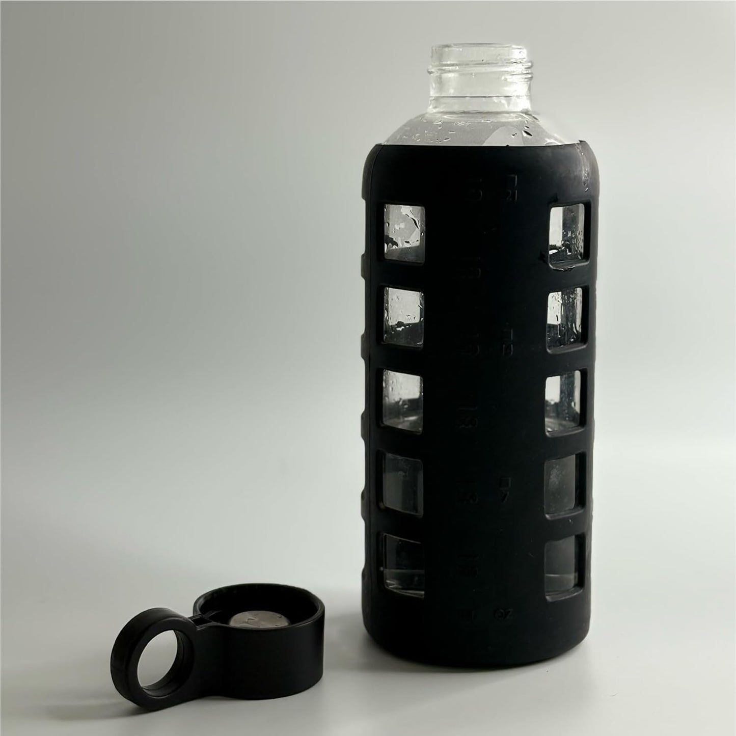 purifyou 40oz / 32oz / 22oz / 12oz Borosilicate Glass Water Bottle with Time & Volume Markers, Silicone Sleeve, Stainless Steel Lid | Reusable Glass Bottle for Water & Juice (40oz Jet Black)
