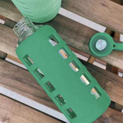 purifyou 40oz / 32oz / 22oz / 12oz Borosilicate Glass Water Bottle with Time & Volume Markers, Silicone Sleeve, Stainless Steel Lid | Reusable Glass Bottle for Water & Juice (40oz Jet Black)