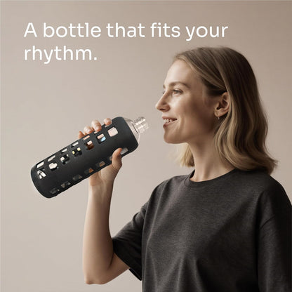 purifyou 40oz / 32oz / 22oz / 12oz Borosilicate Glass Water Bottle with Time & Volume Markers, Silicone Sleeve, Stainless Steel Lid | Reusable Glass Bottle for Water & Juice (40oz Jet Black)
