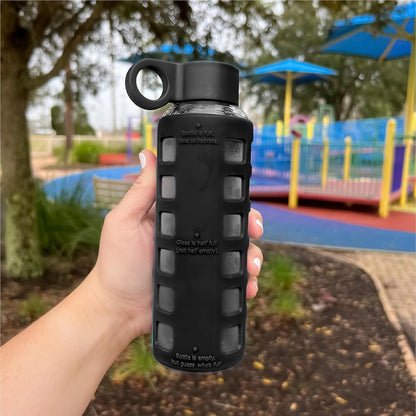 purifyou 40oz / 32oz / 22oz / 12oz Borosilicate Glass Water Bottle with Time & Volume Markers, Silicone Sleeve, Stainless Steel Lid | Reusable Glass Bottle for Water & Juice (40oz Jet Black)